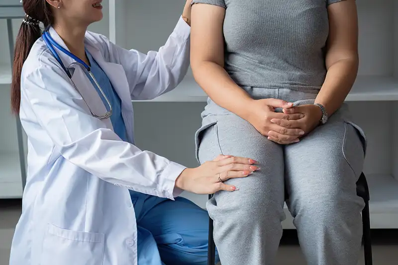 A woman at a doctors office learning about an overactive bladder.