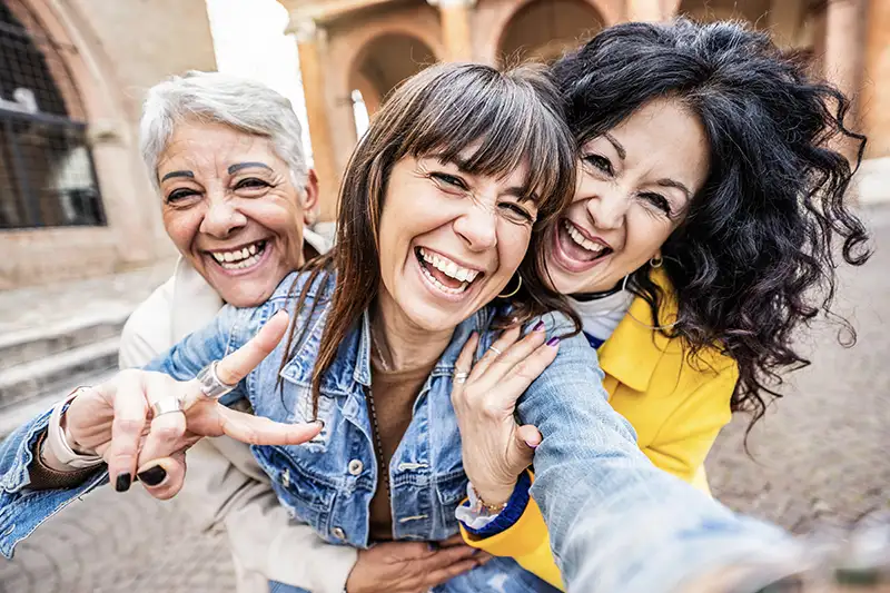 Happy women celebrating receiving treatment for bladder issues.